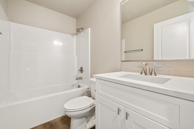 3054 S Quay St, Kennewick, WA 99338 - full bath with wood finished floors, vanity,  shower combination, and tasteful backsplash
