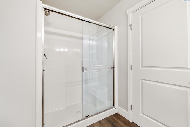 3054 S Quay St, Kennewick, WA 99338 - full bathroom with a stall shower and wood finished floors