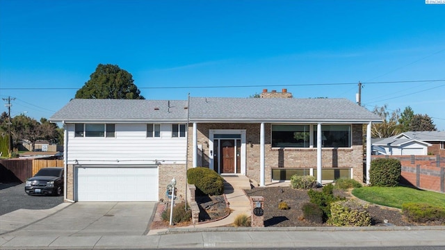 bi-level home featuring a garage