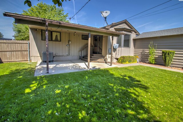 2002 Everest Ave, Richland, WA 99354 - back of house featuring a patio, central AC unit, and board and batten siding