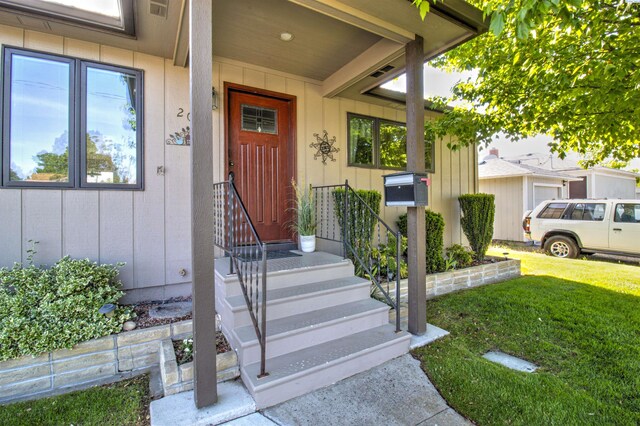 2002 Everest Ave, Richland, WA 99354 - doorway to property with a yard and board and batten siding