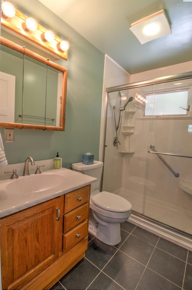 2002 Everest Ave, Richland, WA 99354 - full bath featuring tile patterned flooring, a stall shower, vanity, and toilet