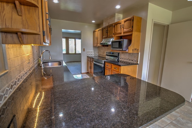 2002 Everest Ave, Richland, WA 99354 - kitchen featuring appliances with stainless steel finishes, open shelves, a sink, under cabinet range hood, and brown cabinetry