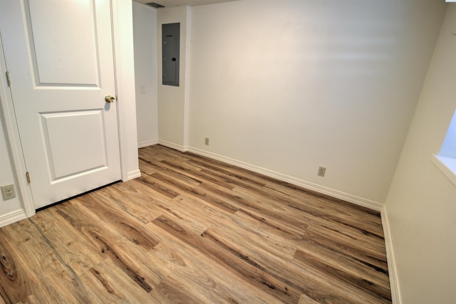 2002 Everest Ave, Richland, WA 99354 - unfurnished bedroom featuring electric panel, light wood finished floors, and baseboards