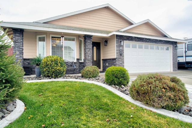 view of front of home featuring a garage and a front lawn