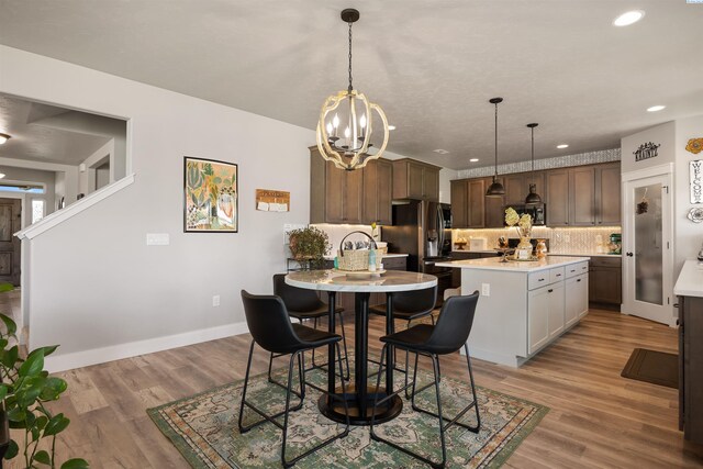 5901 W Ruby St, Pasco, WA 99301 - dining area featuring a chandelier, light wood-type flooring, baseboards, and recessed lighting