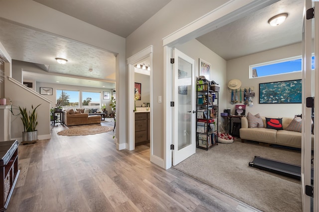 5901 W Ruby St, Pasco, WA 99301 - living room featuring healthy amount of natural light, wood finished floors, french doors, and baseboards