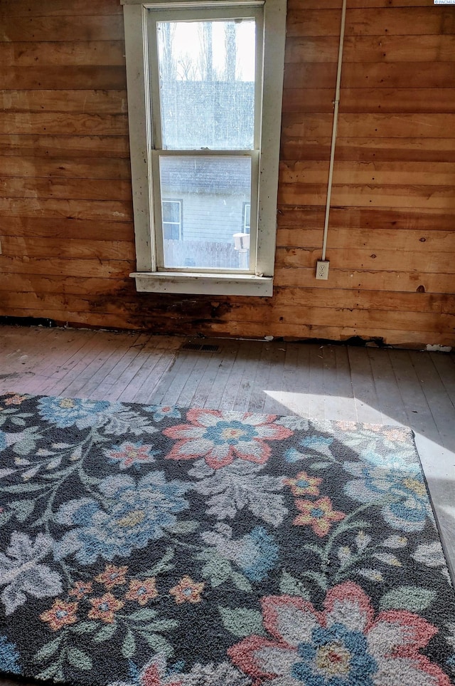 205 E 2nd St, Spangle, WA 99031 - spare room featuring wood-type flooring and wood walls