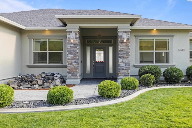 doorway to property featuring a yard