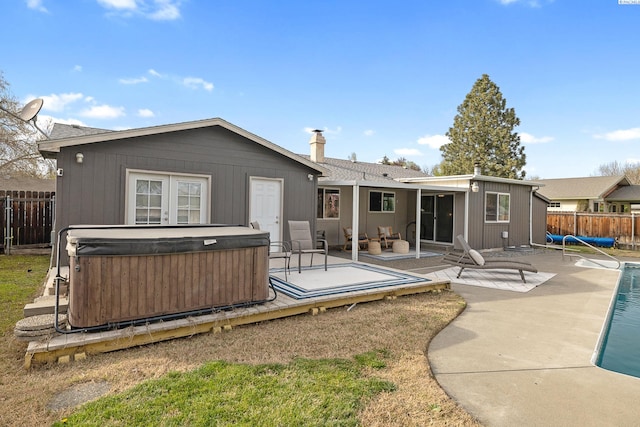 2128 Shasta Ave, Richland, WA 99354 - rear view of house with a fenced in pool, a patio area, a fenced backyard, and a hot tub