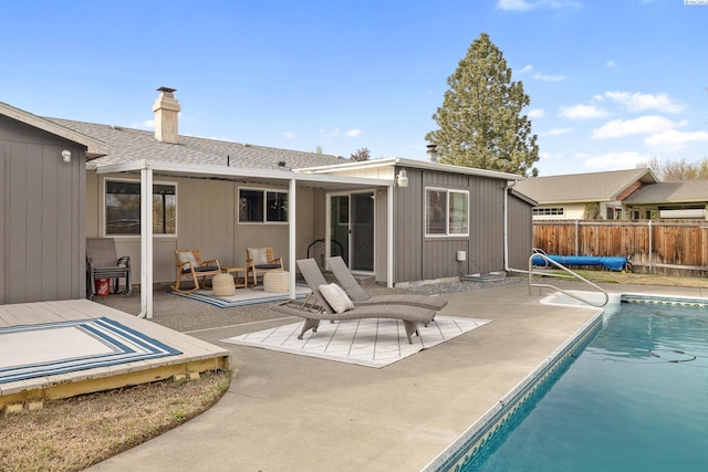 2128 Shasta Ave, Richland, WA 99354 - back of house featuring a chimney, a patio area, a fenced in pool, and fence