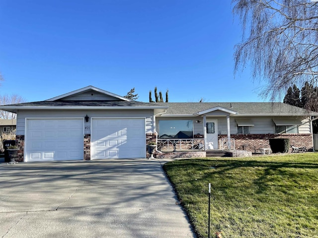 ranch-style house with a garage and a front yard