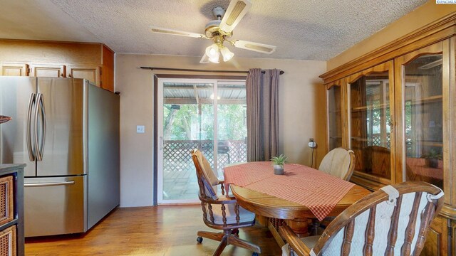 2816 S Cedar St, Kennewick, WA 99337 - dining room with a textured ceiling, light wood-style floors, and a ceiling fan