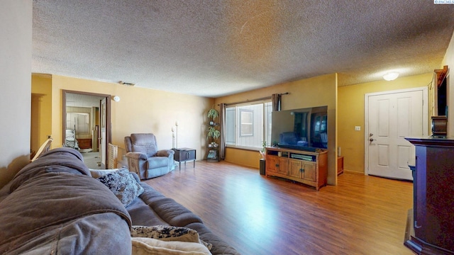 2816 S Cedar St, Kennewick, WA 99337 - living area with light wood-type flooring and a textured ceiling