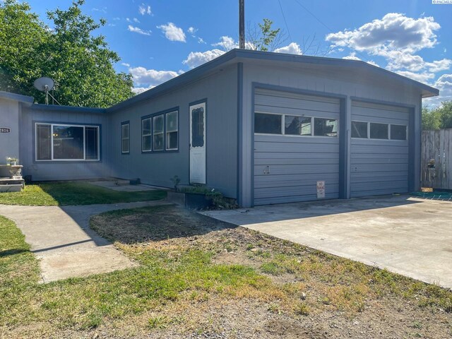 2816 S Cedar St, Kennewick, WA 99337 - view of property exterior featuring a garage and concrete driveway