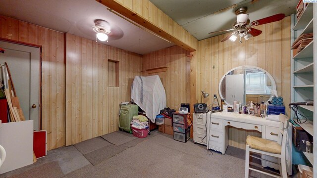 2816 S Cedar St, Kennewick, WA 99337 - miscellaneous room with wood walls, ceiling fan, and carpet flooring