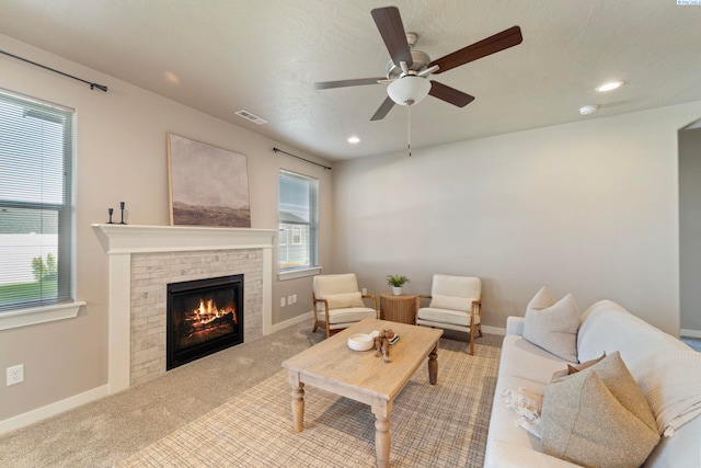 6223 Berea Ln, Pasco, WA 99301 - living room with a brick fireplace, ceiling fan, carpet floors, and recessed lighting