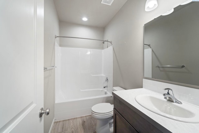 6223 Berea Ln, Pasco, WA 99301 - bathroom featuring vanity, wood finished floors, shower / tub combination, recessed lighting, and backsplash