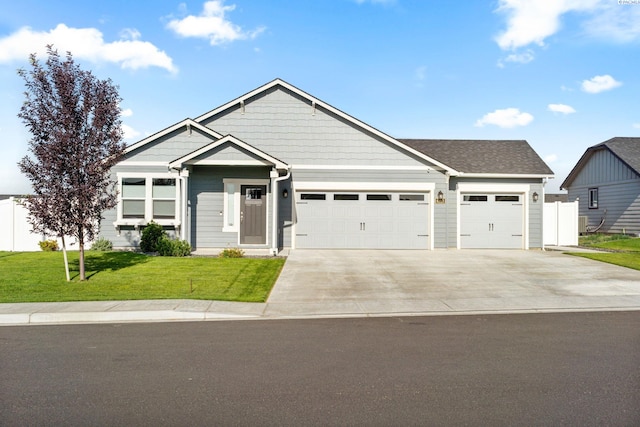 6223 Berea Ln, Pasco, WA 99301 - view of front facade featuring a garage, concrete driveway, and a front lawn