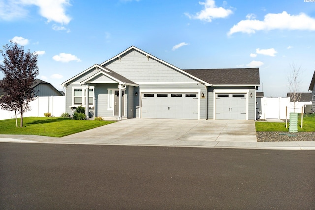 6223 Berea Ln, Pasco, WA 99301 - view of front of house with a garage, concrete driveway, and roof with shingles