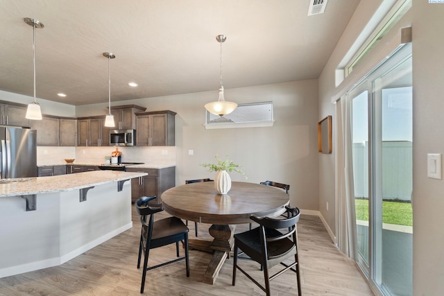 6223 Berea Ln, Pasco, WA 99301 - dining space with light wood finished floors and recessed lighting