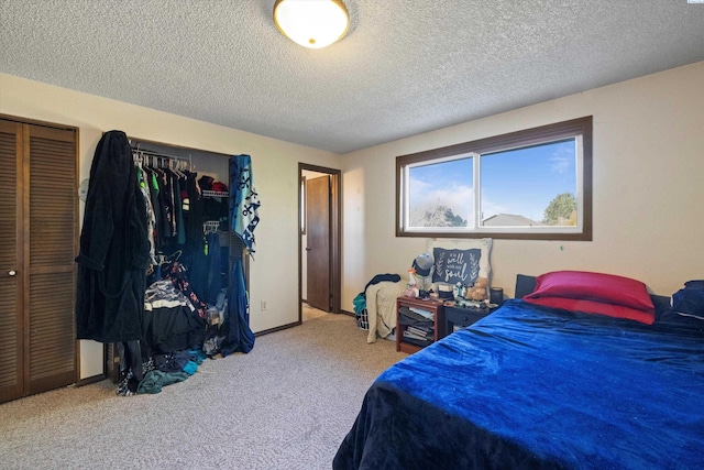 carpeted bedroom featuring a textured ceiling