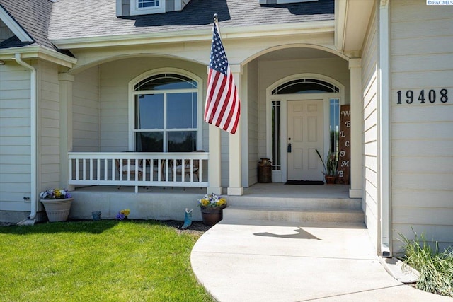 19408 Quail Run Pr SW, Prosser, WA 99350 - property entrance with a shingled roof, covered porch, and a yard