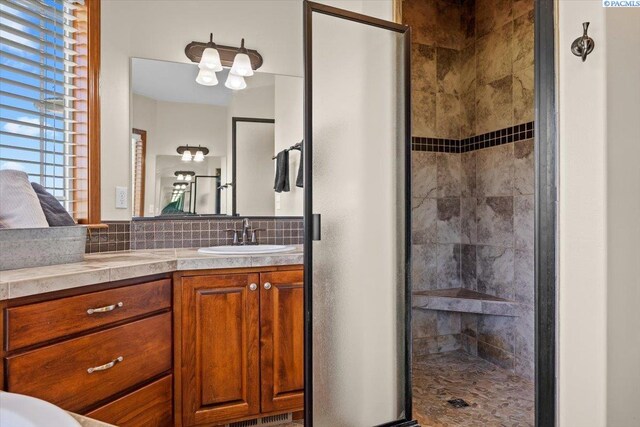 19408 Quail Run Pr SW, Prosser, WA 99350 - full bath with a stall shower, vanity, and decorative backsplash