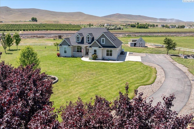 19408 Quail Run Pr SW, Prosser, WA 99350 - view of front of property with a view of countryside, a mountain view, a front lawn, and driveway