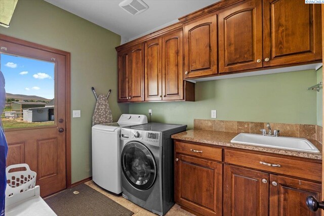 19408 Quail Run Pr SW, Prosser, WA 99350 - washroom with cabinet space and washer and clothes dryer