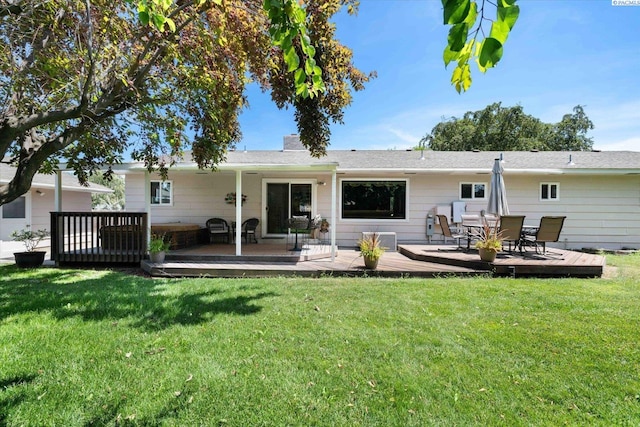 3916 S Date St, Kennewick, WA 99337 - back of property featuring a wooden deck and a lawn