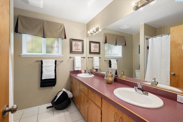 3916 S Date St, Kennewick, WA 99337 - full bath featuring tile patterned flooring, double vanity, and a shower with shower curtain