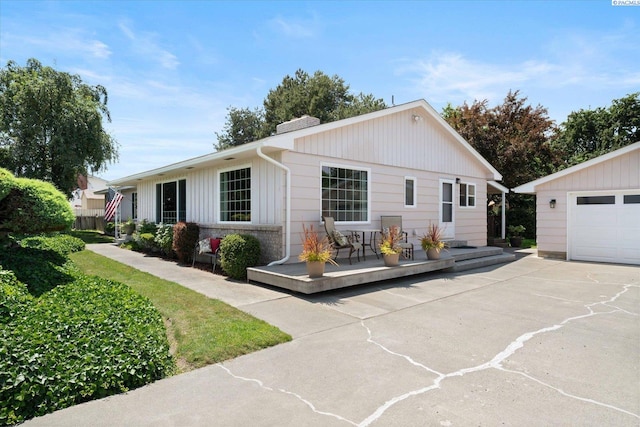 3916 S Date St, Kennewick, WA 99337 - single story home featuring a chimney, driveway, a garage, and a deck