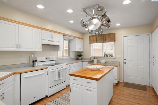 3916 S Date St, Kennewick, WA 99337 - kitchen with white appliances, under cabinet range hood, wooden counters, white cabinetry, and light wood-style floors