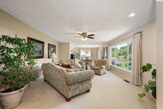 3916 S Date St, Kennewick, WA 99337 - carpeted living room featuring a chandelier, ceiling fan, and recessed lighting