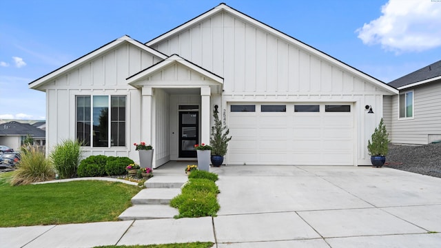 2545 Morris Ave, Richland, WA 99352 - modern inspired farmhouse featuring board and batten siding, an attached garage, concrete driveway, and a front yard