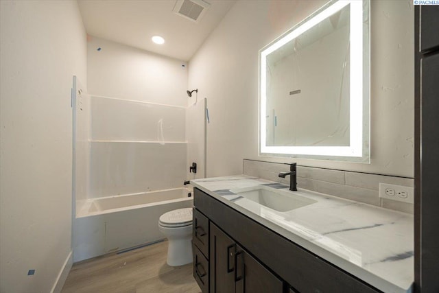 4218 W 19th Ave, Kennewick, WA 99337 - bathroom with vanity, wood finished floors, and tub / shower combination