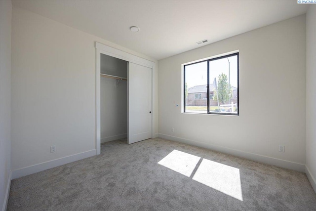 4218 W 19th Ave, Kennewick, WA 99337 - unfurnished bedroom with light colored carpet and a closet