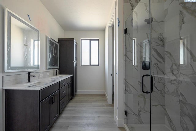 4218 W 19th Ave, Kennewick, WA 99337 - full bath with double vanity, a marble finish shower, and wood finished floors