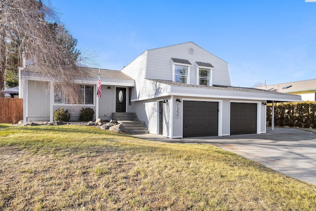 view of front of house featuring a garage and a front yard