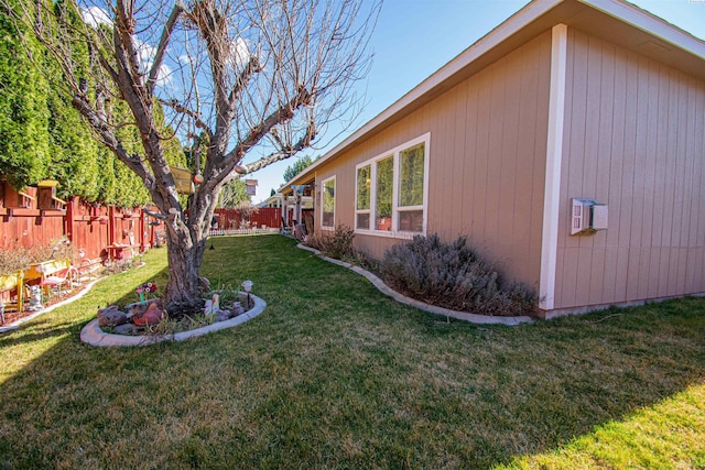 view of yard with a fenced backyard