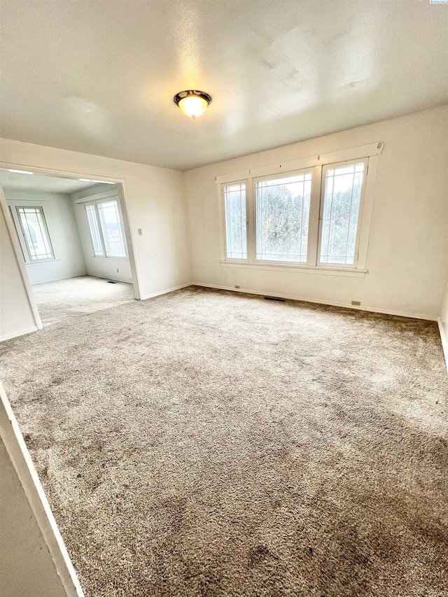 empty room with carpet flooring