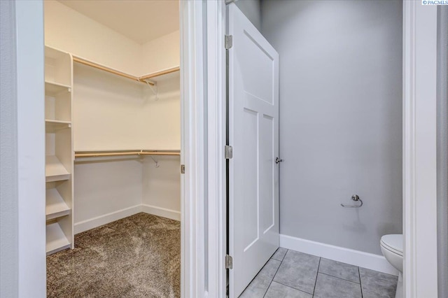 spacious closet featuring tile patterned flooring