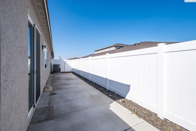 view of patio / terrace with a fenced backyard and cooling unit