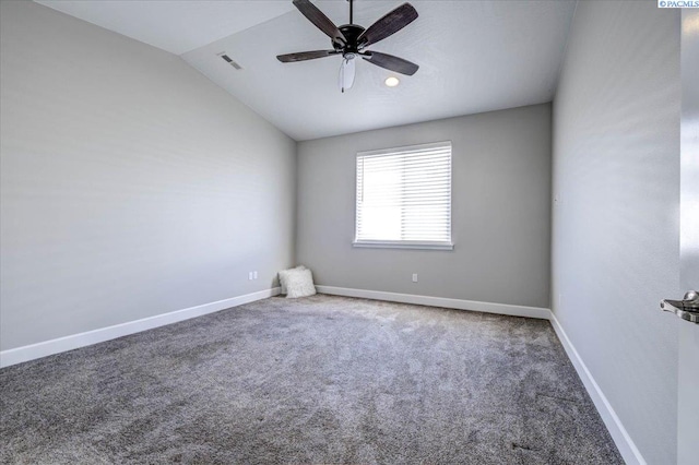 spare room featuring visible vents, a ceiling fan, carpet, and vaulted ceiling