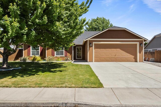 5168 Chris St, West Richland, WA 99353 - single story home featuring a garage and concrete driveway