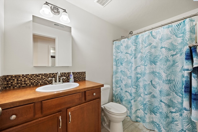 5168 Chris St, West Richland, WA 99353 - bathroom featuring toilet, vanity, backsplash, and a shower with curtain