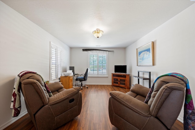 5168 Chris St, West Richland, WA 99353 - living room featuring wood finished floors, a desk, and baseboards
