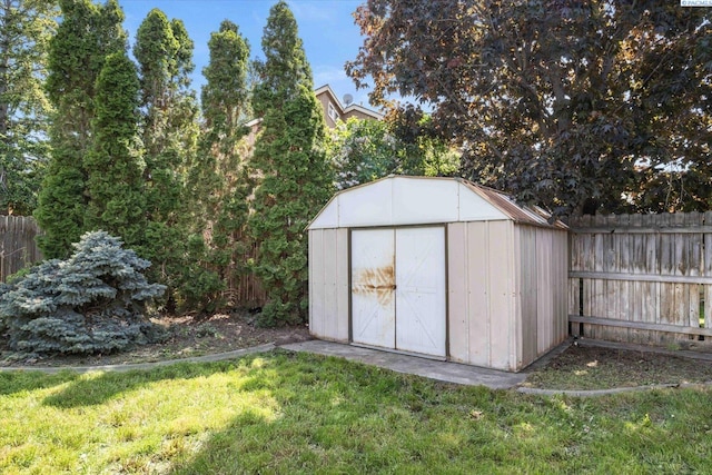 view of shed featuring a fenced backyard