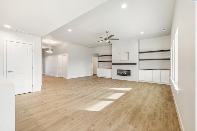 6531 W 30th Pl, Kennewick, WA 99338 - unfurnished living room with a ceiling fan, light wood-style floors, recessed lighting, and a large fireplace